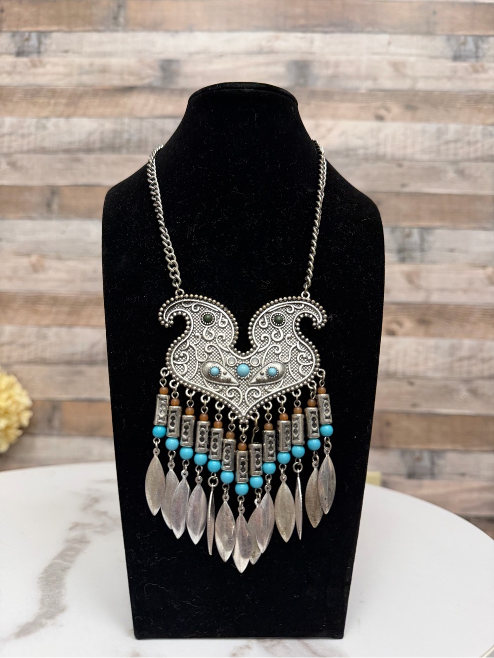 Metal w/ turquoise colore stones and feather pendant bohemian style